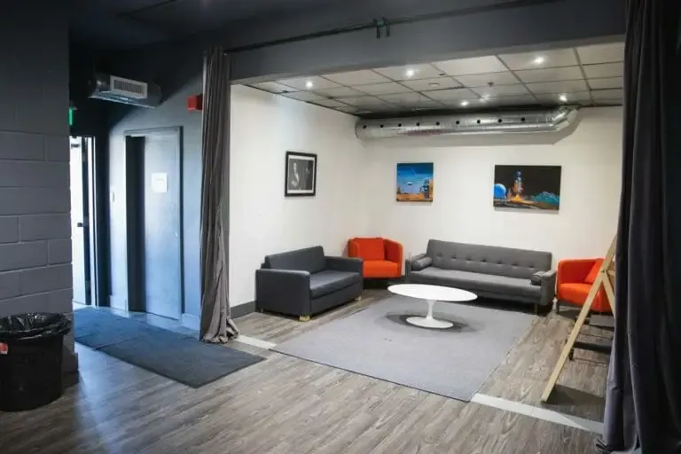 The support room after, sofas and a rug set out as a lounge