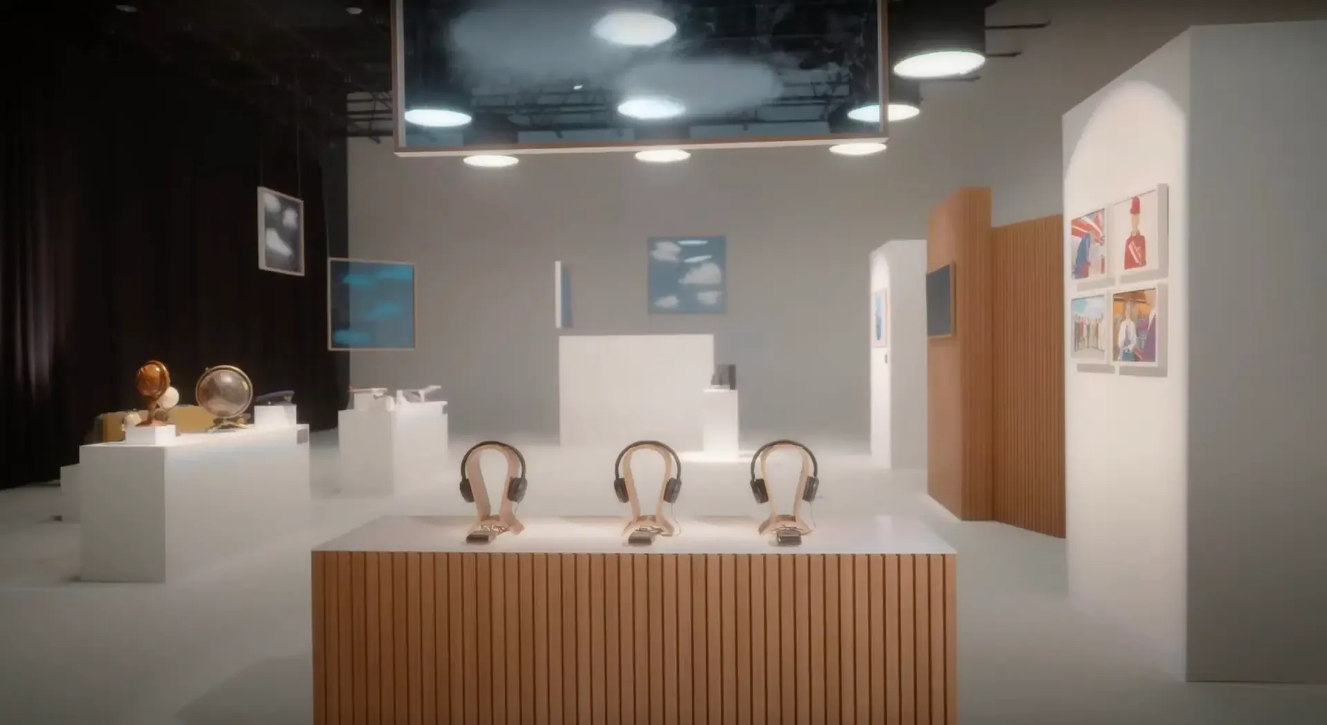 A gallery style retail experience built on the stage, with plinths, artwork and headphones