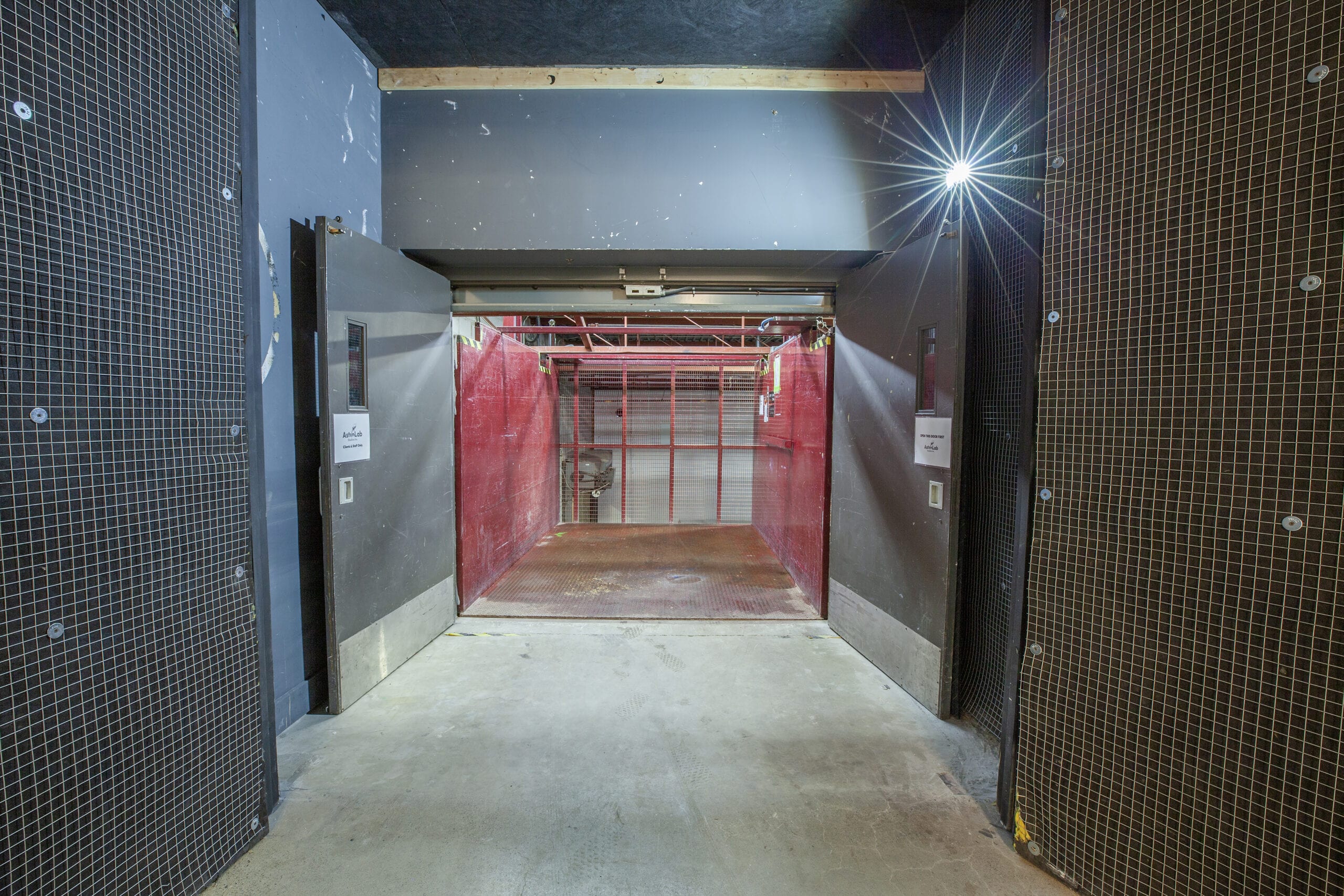 The freight elevator with both of its doors standing open